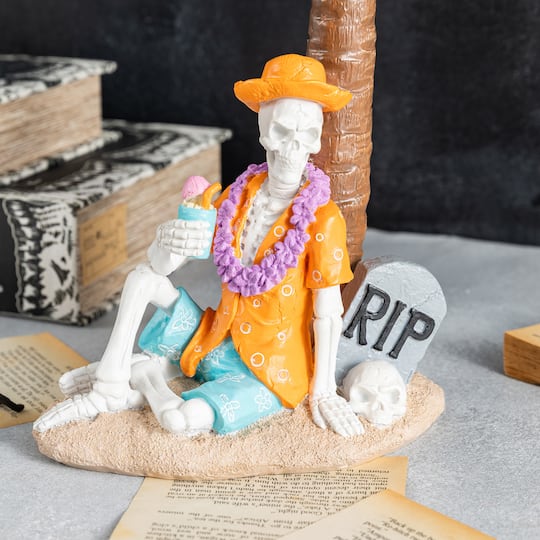 Glitzhome® 11.5" Halloween Polyresin Skeleton on Beach Table Decor